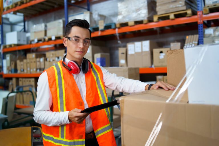 Portrait of a young worker of a logistics warehouse